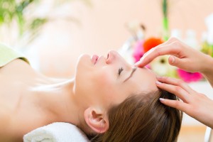 Wellness - woman getting head massage in Spa